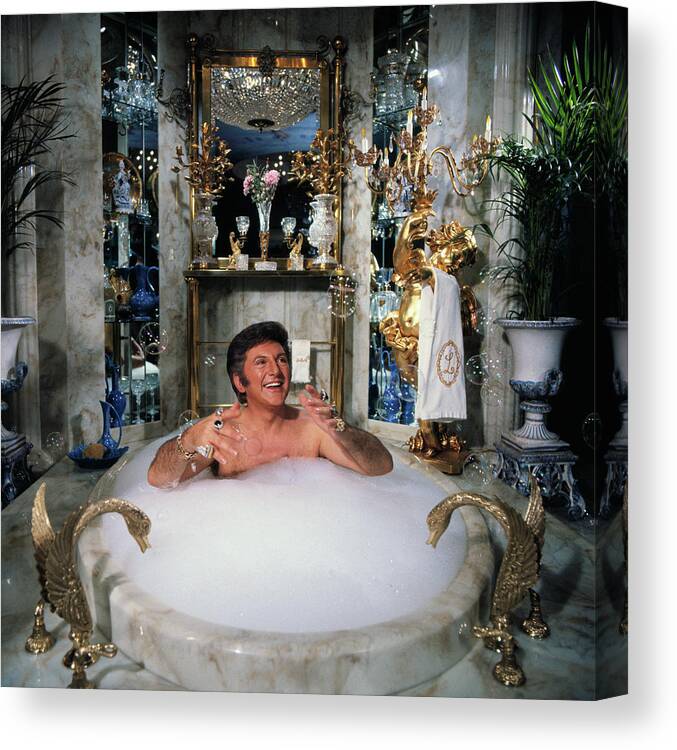 Mature Adult Canvas Print featuring the photograph Liberace Taking A Bubble Bath by Bettmann