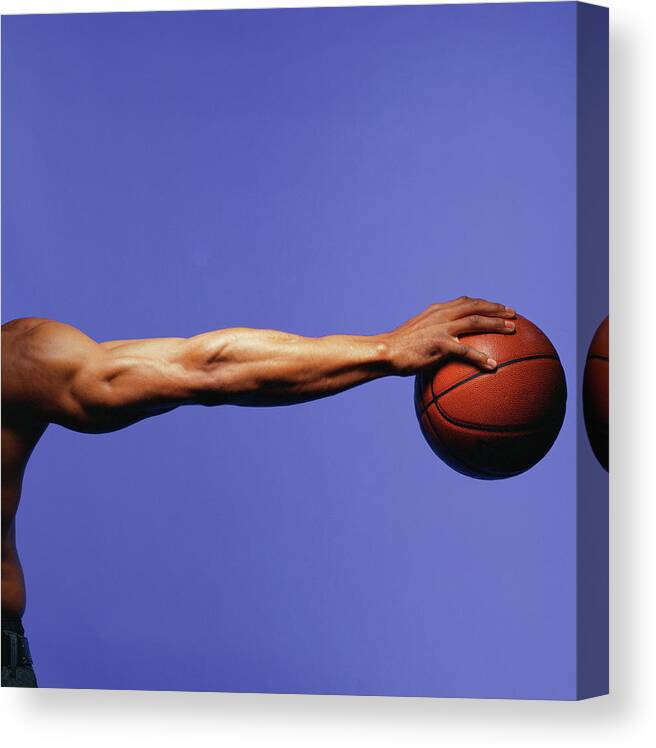 Human Arm Canvas Print featuring the photograph Man Palming Basketball, Close-up Of Arm by Blaise Hayward