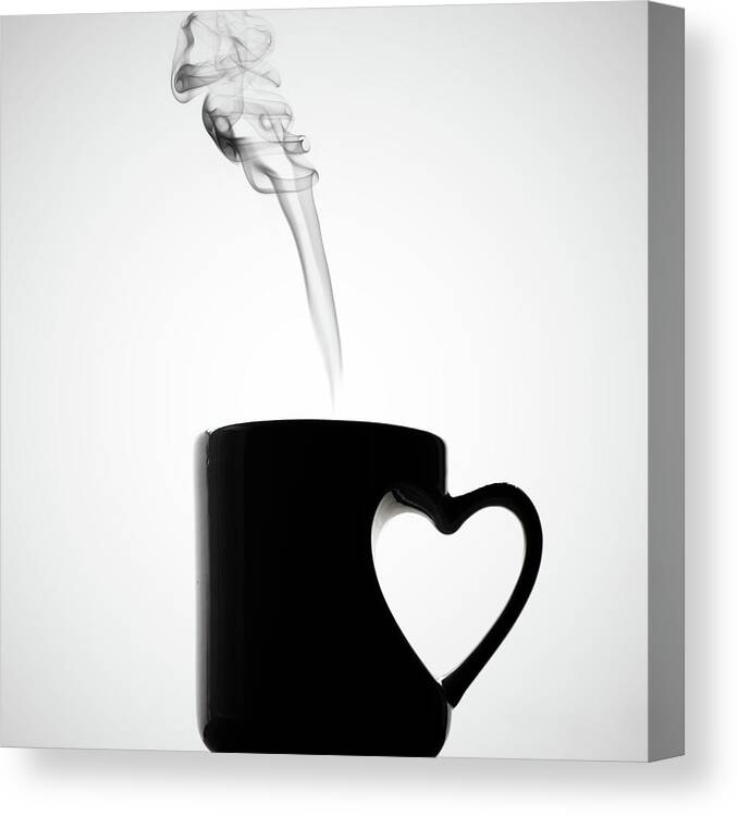 White Background Canvas Print featuring the photograph Mug Of Coffee With Handle Of Heart Shape by Saulgranda