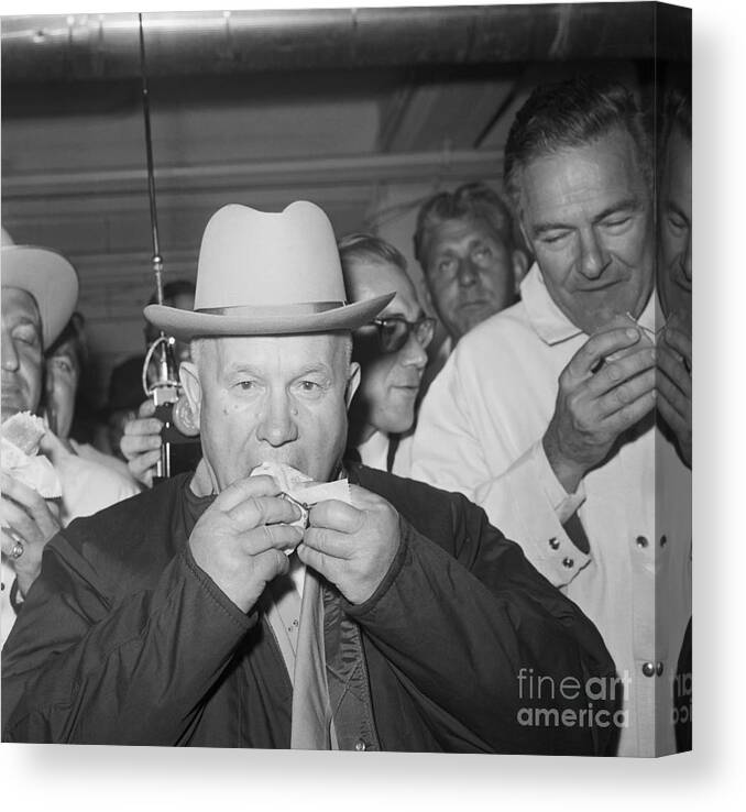 Mature Adult Canvas Print featuring the photograph Nikita Khrushchev Eating A Hot Dog by Bettmann