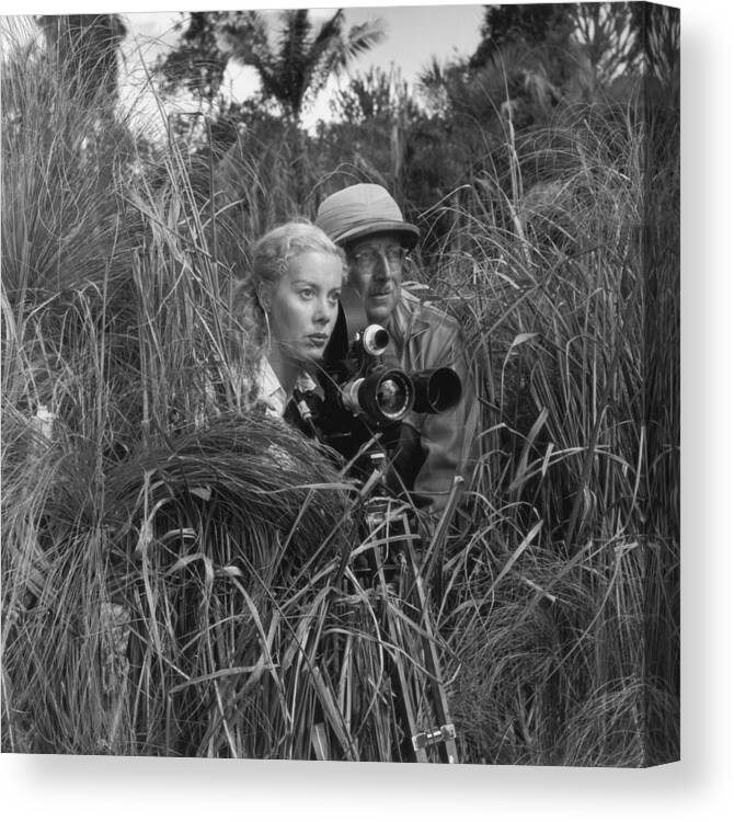 Hiding Canvas Print featuring the photograph Secret Filming by Thurston Hopkins