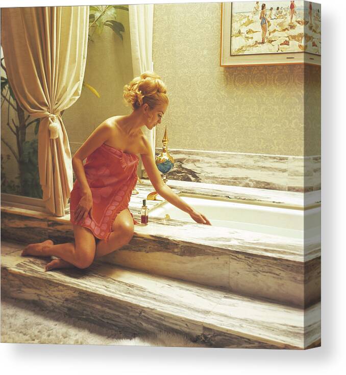 People Canvas Print featuring the photograph Testing The Bathwater by Tom Kelley Archive