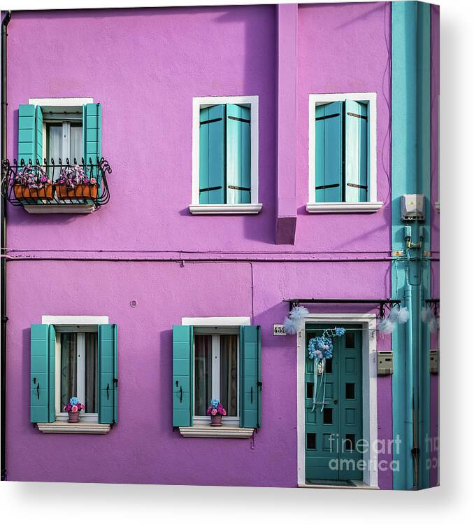 Wall Canvas Print featuring the photograph A pink house in Burano, Italy by Lyl Dil Creations