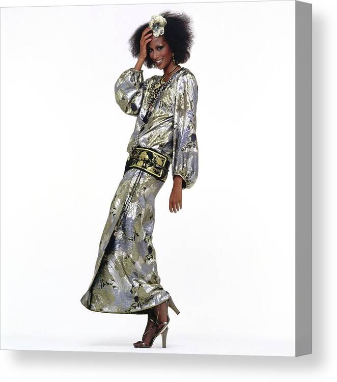 Fashion Canvas Print featuring the photograph Beverly Johnson Wearing A Silver Saint Laurent Dress by Albert Watson