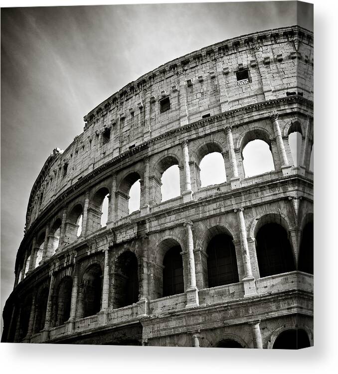 Colosseumamphitheatrumflaviumamphitheatreamphitheaterromanitalyarenastadiumcoliseumancienthistoryruinfamousarchitecturegladiatorhistorichistoricallandmarkmonumentoldcultureempireromeexterioritalianskybuildingtraveleuropeanstonedaysummerforumtheaterarchaeologyplaceoutdoorarchheritagesightseeingcityurbanarcheologycolumnattractionflaviansepiamonochromedave Bowman Photography Canvas Print featuring the photograph Colosseum by Dave Bowman