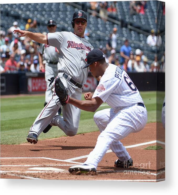 Joe Mauer Canvas Print featuring the photograph Joe Mauer and Luis Perdomo by Denis Poroy