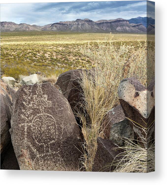 Petroglyphs Canvas Print featuring the photograph Jornada Anthropomorph with Cloud Terrace and Plant Stalk by Kathleen Bishop