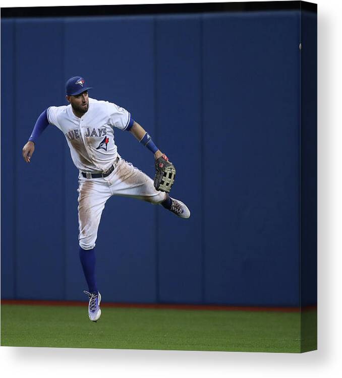 People Canvas Print featuring the photograph Kevin Pillar and Jonathan Schoop by Tom Szczerbowski