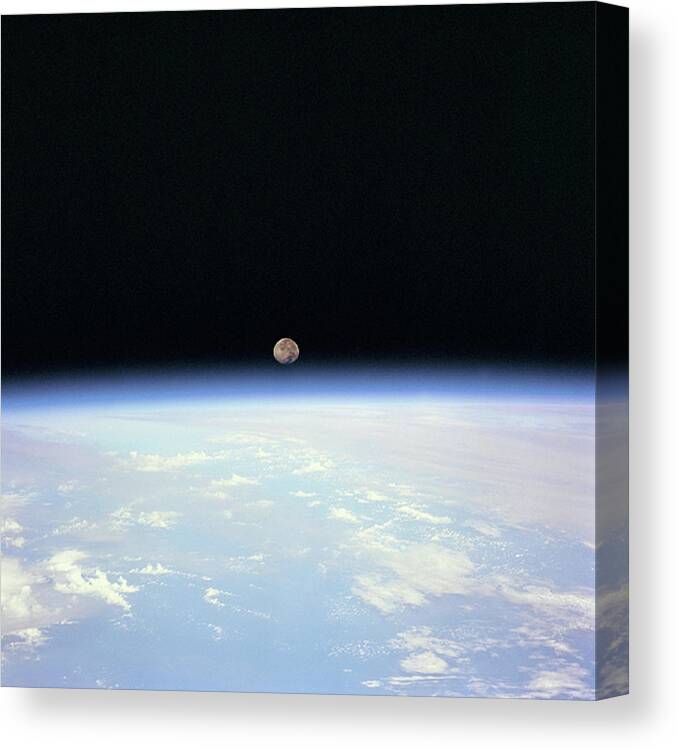 Moonrise Over Earth Horizon Canvas Print featuring the digital art Moonrise by Stoneworks Imagery