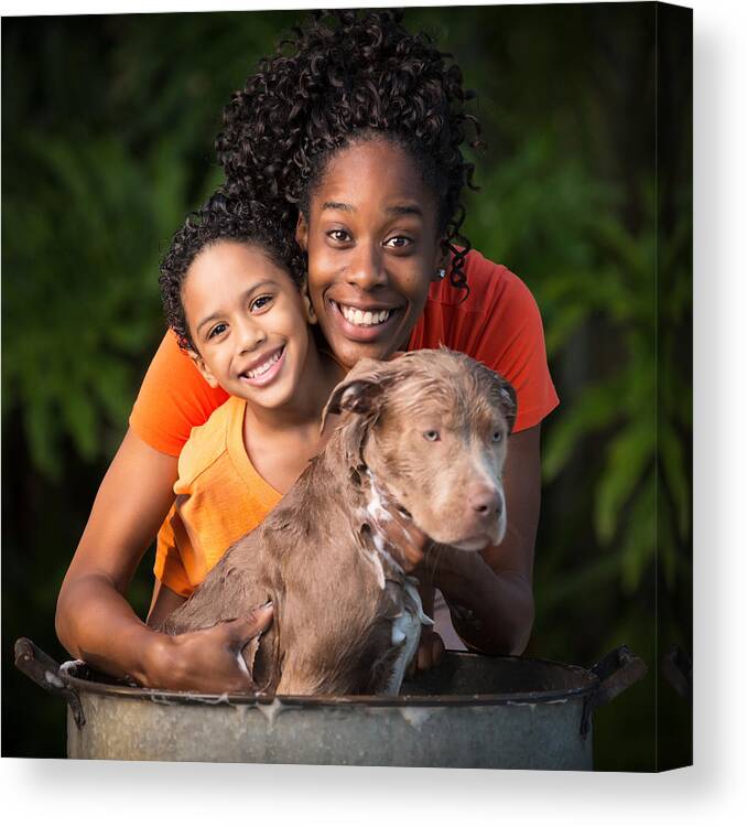 Pets Canvas Print featuring the photograph Mother and son bathing dog by Thepalmer