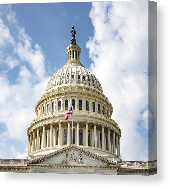 Statue Canvas Print featuring the photograph US Capitol Building - dome and flag by Photo by Mike Kline (notkalvin)