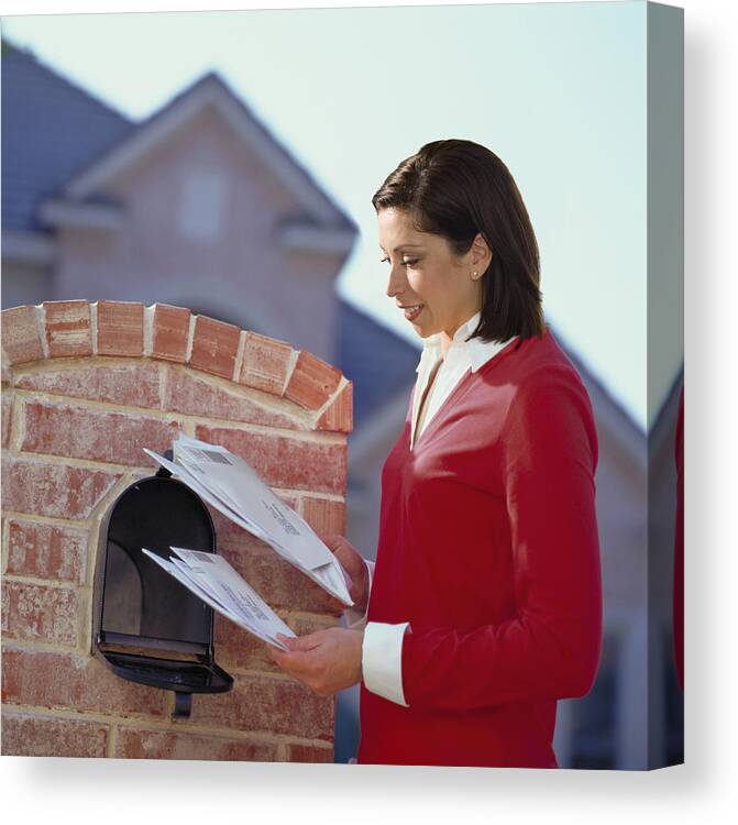 People Canvas Print featuring the photograph Woman getting mail from mailbox by Steve McAlister