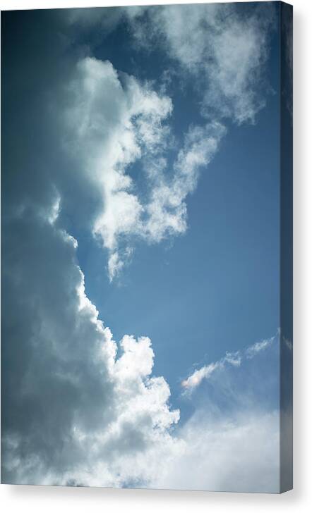 Air Canvas Print featuring the photograph Puffy clouds by Mike Fusaro