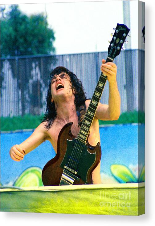 Angus Young Canvas Print featuring the photograph Angus Young of A C D C at Day on the Green Monsters of Rock 7-21-79 by Daniel Larsen