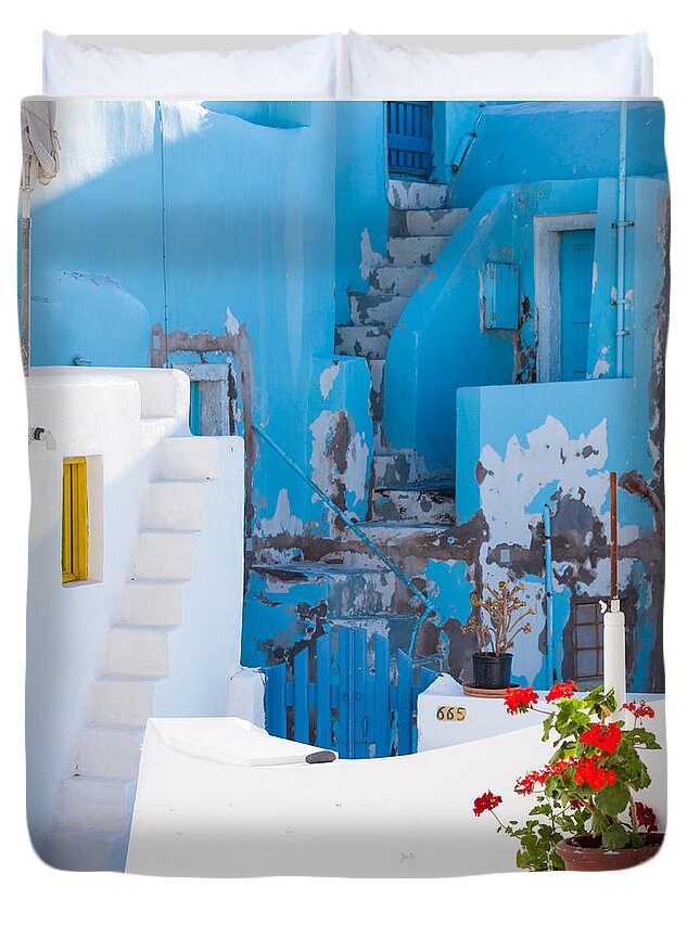 Glimpse Duvet Cover featuring the photograph Glimpse of typical white houses in Oia Santorini Greece #1 by Matteo Colombo