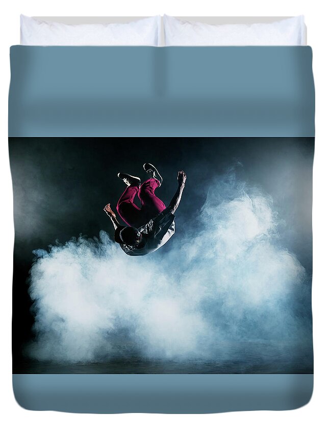 Copenhagen Duvet Cover featuring the photograph Dancer Leaping Through Smoke #2 by Henrik Sorensen