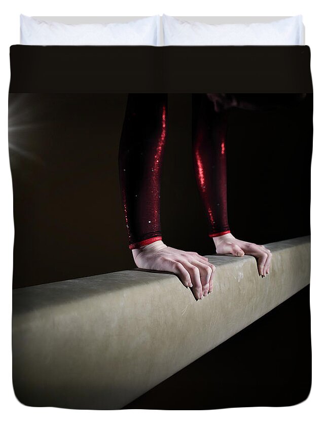 Human Arm Duvet Cover featuring the photograph Female Gymnast On Balancing Beam by Mike Harrington