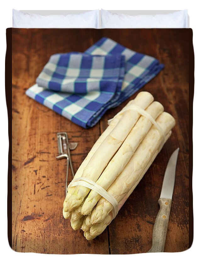 Peeler Duvet Cover featuring the photograph A Bunch Of White Asparagus On A Wooden by Ursula Alter