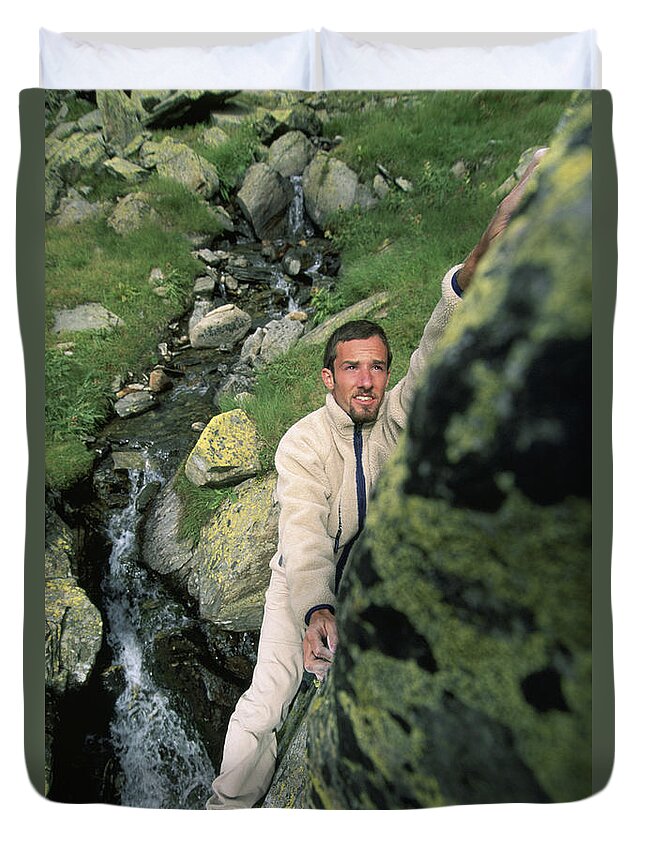 Boulder Duvet Cover featuring the photograph A Man Bouldering In Switzerland by Lars Schneider