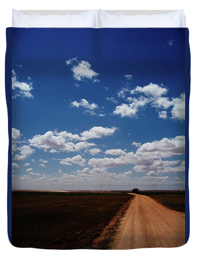 Tranquility Duvet Cover featuring the photograph A Road Vanishing Away In The Distance by Christian.plochacki