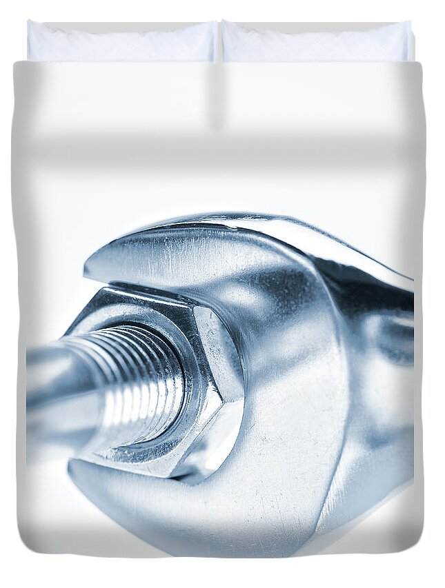 White Background Duvet Cover featuring the photograph A Wrench Turning A Nut Onto A Bolt by Robert George Young