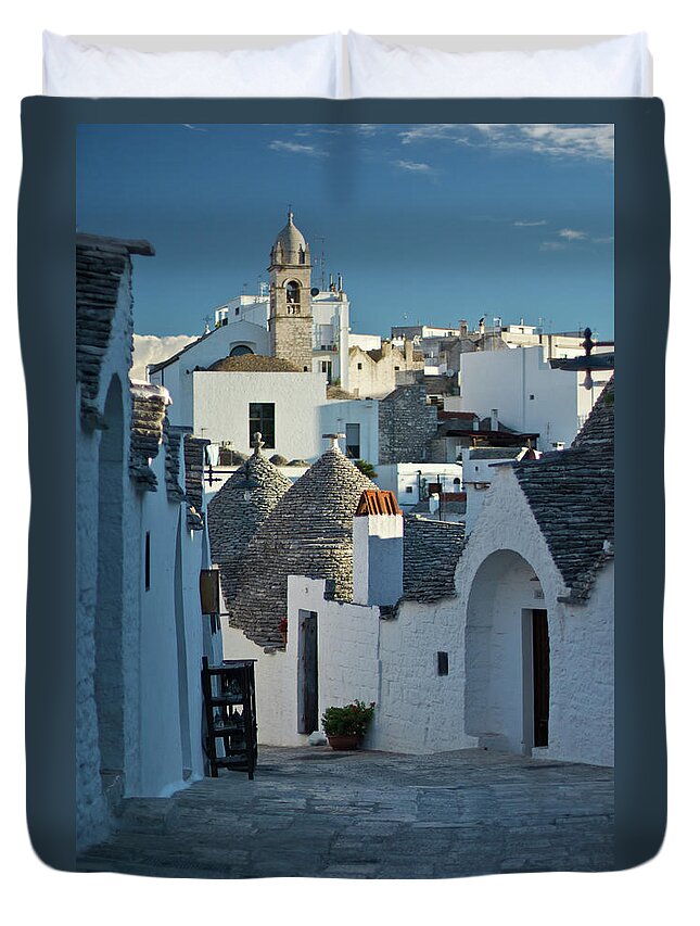 Tranquility Duvet Cover featuring the photograph Alberobello by Phil Carpenter
