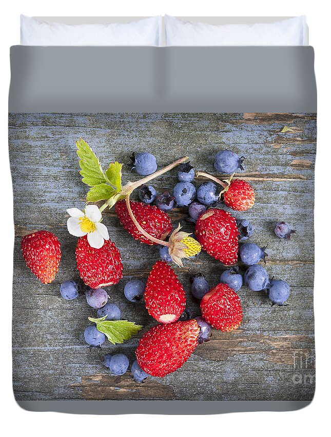 Berries Duvet Cover featuring the photograph Berries on rustic wood by Elena Elisseeva