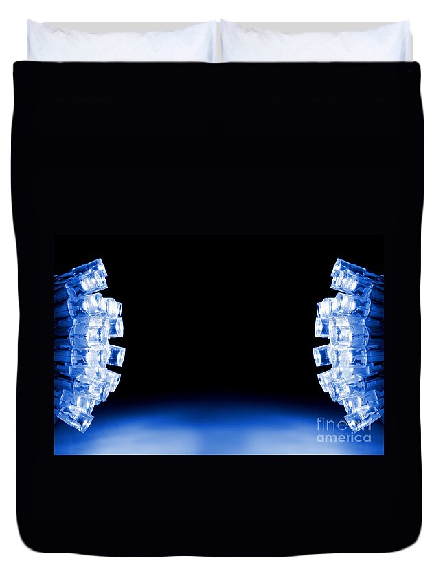 Glowing Duvet Cover featuring the photograph Blue LED lights both sides of the image with space for text by Simon Bratt