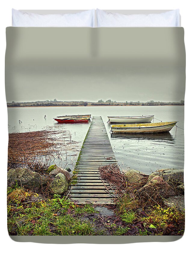 Pier Duvet Cover featuring the photograph Boats by the pier by Mike Santis