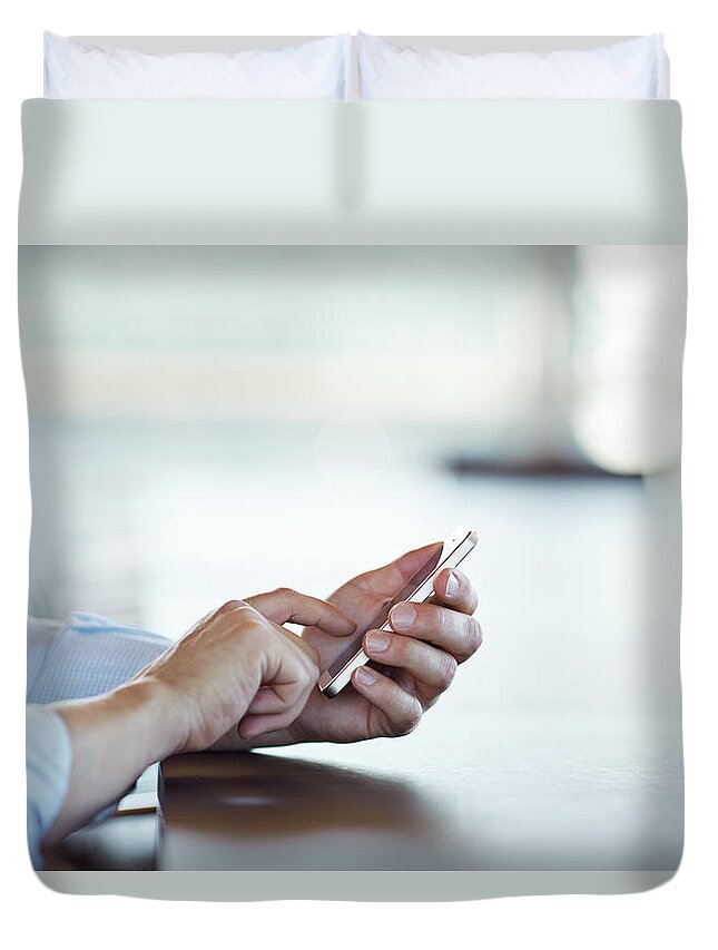 Working Duvet Cover featuring the photograph Close-up Of Hands Scrolling On Phone by Klaus Vedfelt