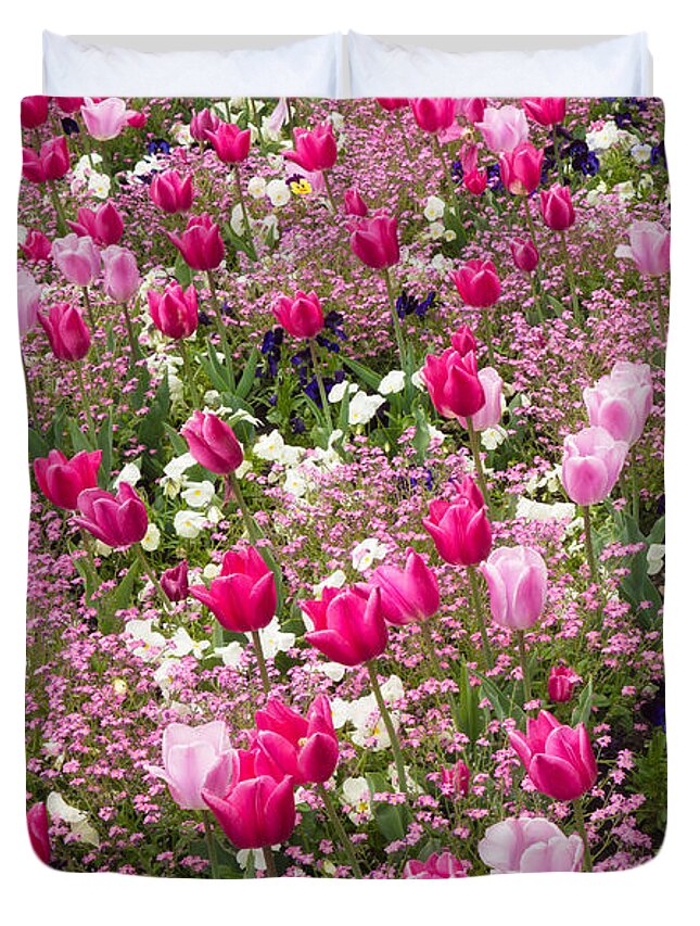 Flowers Duvet Cover featuring the photograph Colorful pink tulips and other flowers in spring by Matthias Hauser