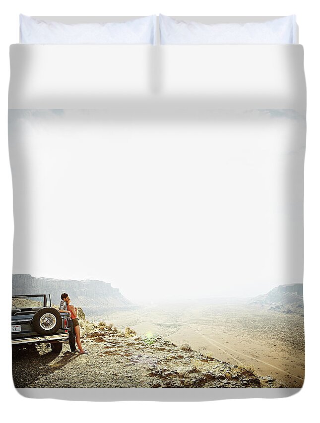 Heterosexual Couple Duvet Cover featuring the photograph Couple Leaning Against Convertible On by Thomas Barwick