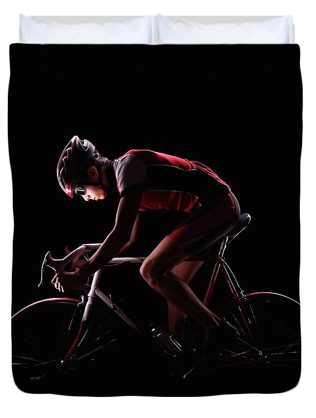 People Duvet Cover featuring the photograph Cyclist On Black Background by Stanislaw Pytel