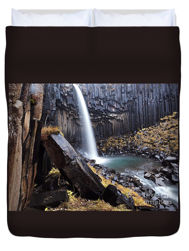 Waterfall Duvet Cover featuring the photograph Flowing through basalt rocks II by Matteo Colombo