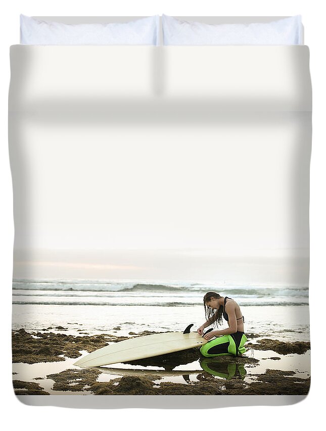 Three Quarter Length Duvet Cover featuring the photograph Girl Preparing Surfing Board On Rocky by Stanislaw Pytel
