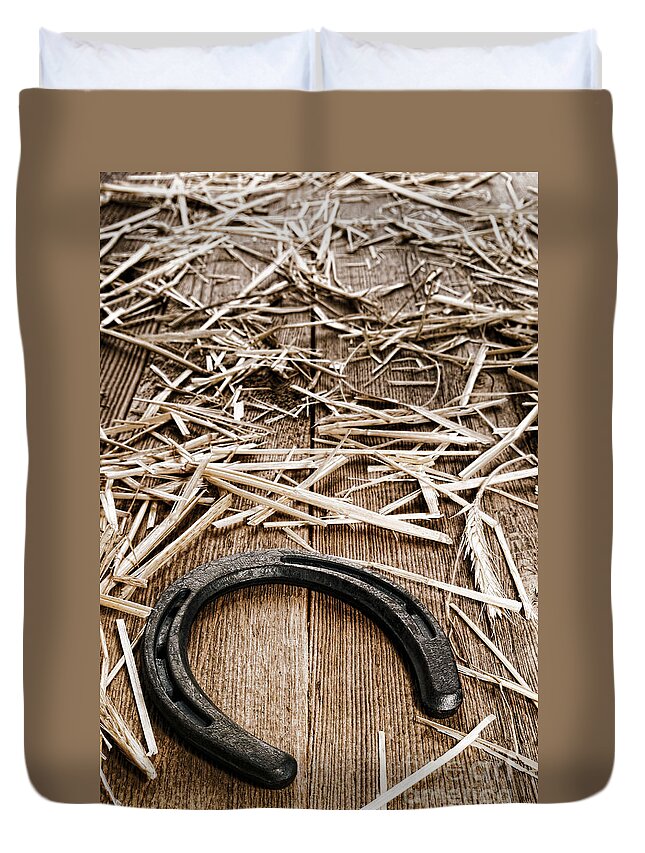 Horseshoe Duvet Cover featuring the photograph Horseshoe on Barn Floor by Olivier Le Queinec