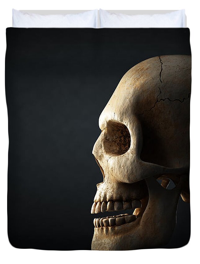 Skull Duvet Cover featuring the photograph Human skull profile on dark background by Johan Swanepoel
