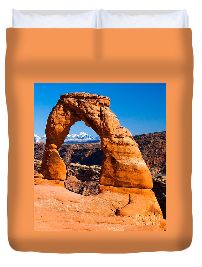 Arches National Park Duvet Cover featuring the photograph La Sal Mtns Through Delicate Arch 01 Arches National Park by Dan Hartford