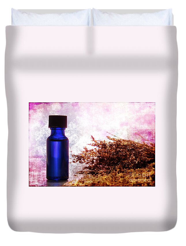 Aromatherapy Duvet Cover featuring the photograph Lavender Essential Oil Bottle by Olivier Le Queinec