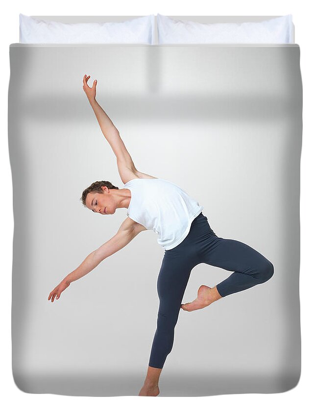 Ballet Dancer Duvet Cover featuring the photograph Male Ballet Dancer Performing A by Yuri