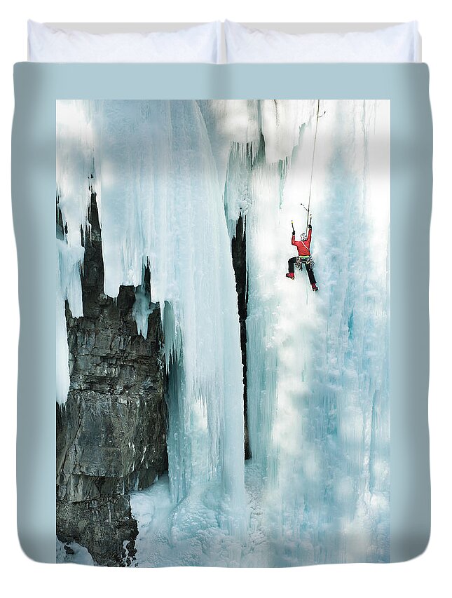 Sports Helmet Duvet Cover featuring the photograph Male Ice Climber Scales Big Ice-covered by Kjell Linder