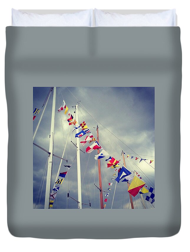Pole Duvet Cover featuring the photograph Marine Signal Flags On Mast Against A by Jodie Griggs
