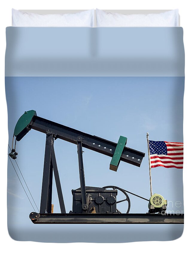 Oil Pump Duvet Cover featuring the photograph Oil pump jack and American flag waving by Imagery by Charly
