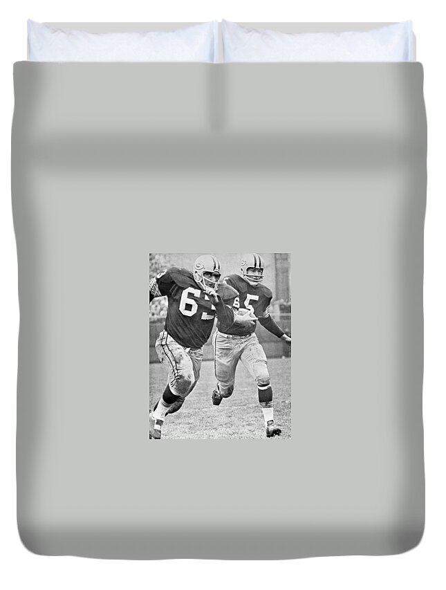 Paul Duvet Cover featuring the photograph Paul Hornung running by Gianfranco Weiss