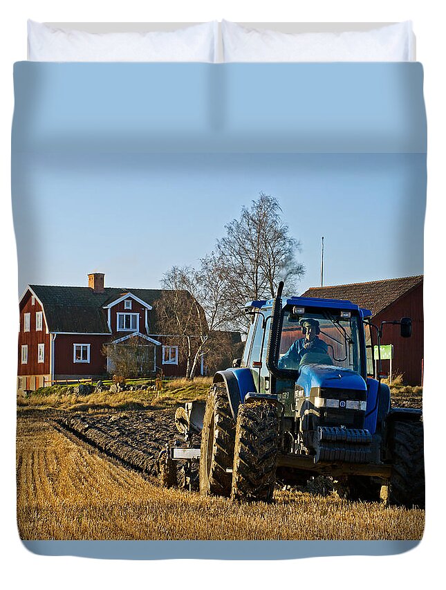 Blue Tractor Duvet Cover featuring the photograph Ploughing by Torbjorn Swenelius