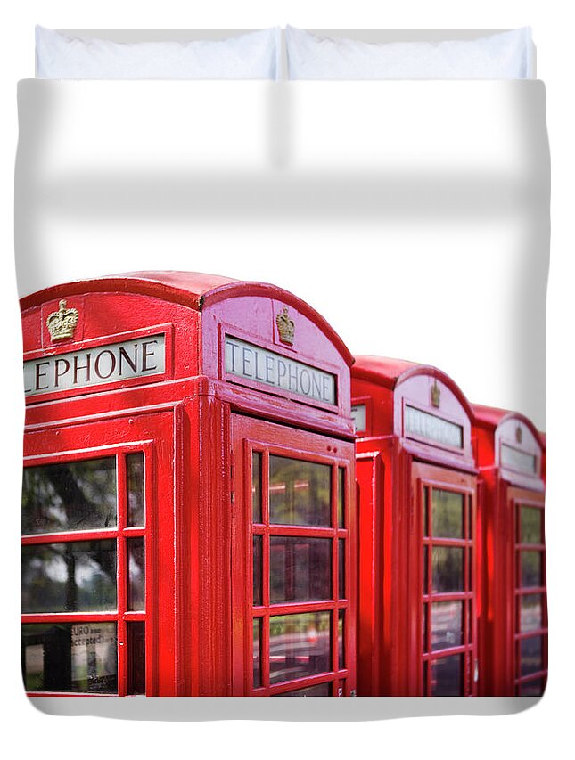 Five Objects Duvet Cover featuring the photograph Red Telephone Boxes Against A White by Richard Boll