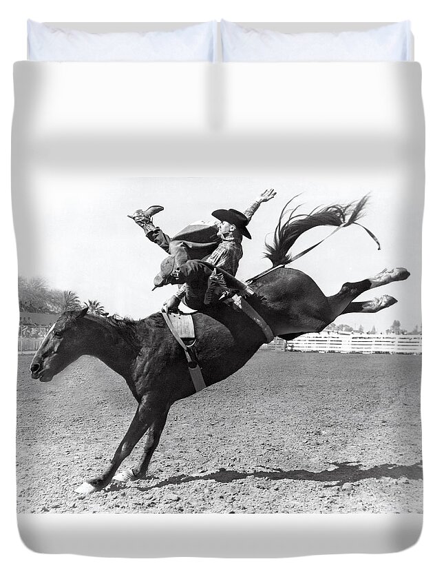 1950 Duvet Cover featuring the photograph Riding A Bucking Bronco by Underwood Archives