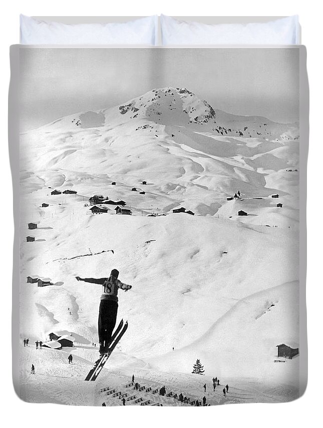 1937 Duvet Cover featuring the photograph Skier Leaping Over A Valley by Underwood Archives