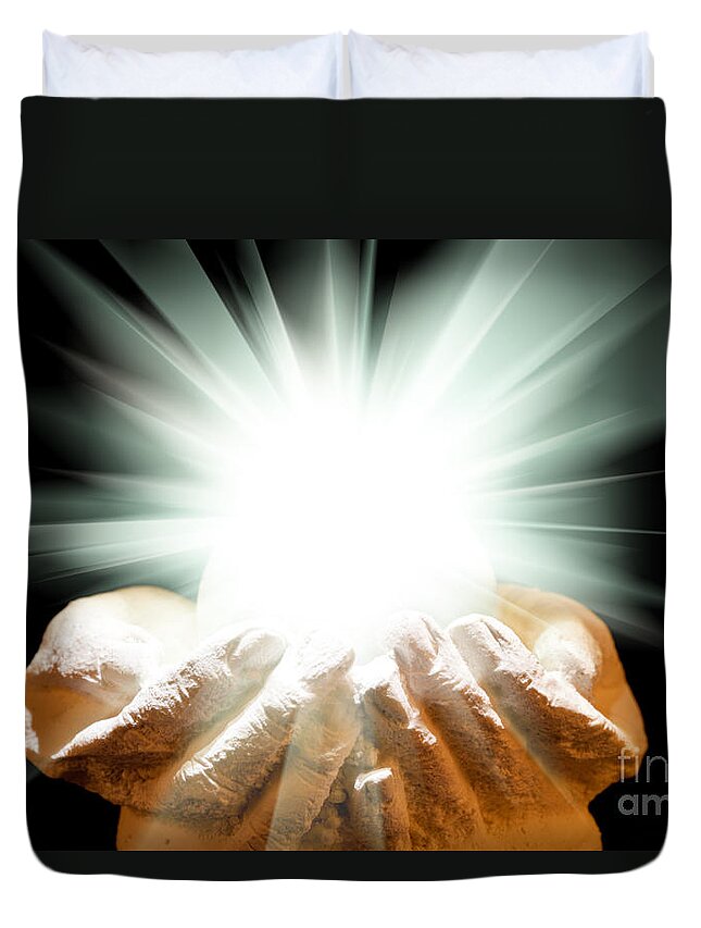 Spiritual Duvet Cover featuring the photograph Spiritual light in cupped hands on a black background by Simon Bratt