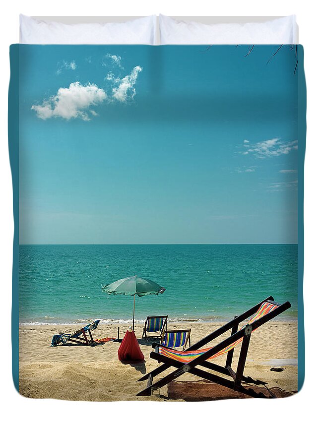 Water's Edge Duvet Cover featuring the photograph Sun Chair On The Beach by Kieran Stone